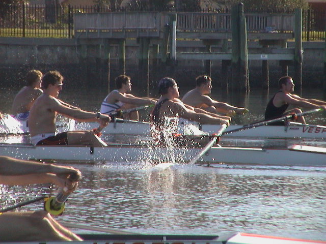 A group of people riding on the back of a boat