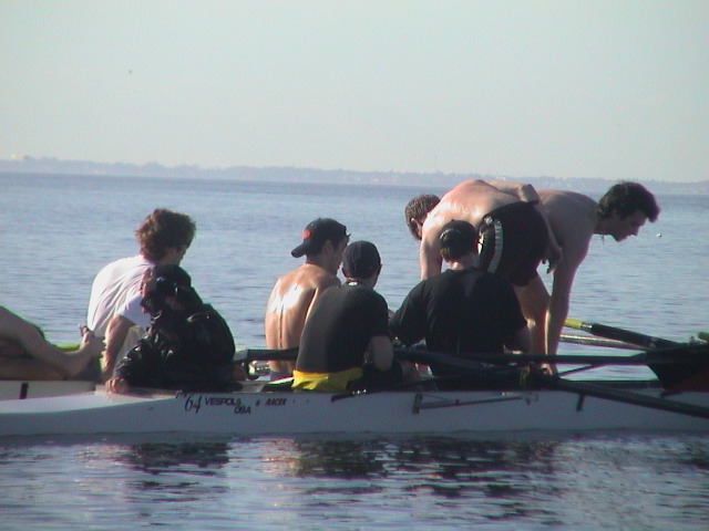 A group of people on a boat in the water