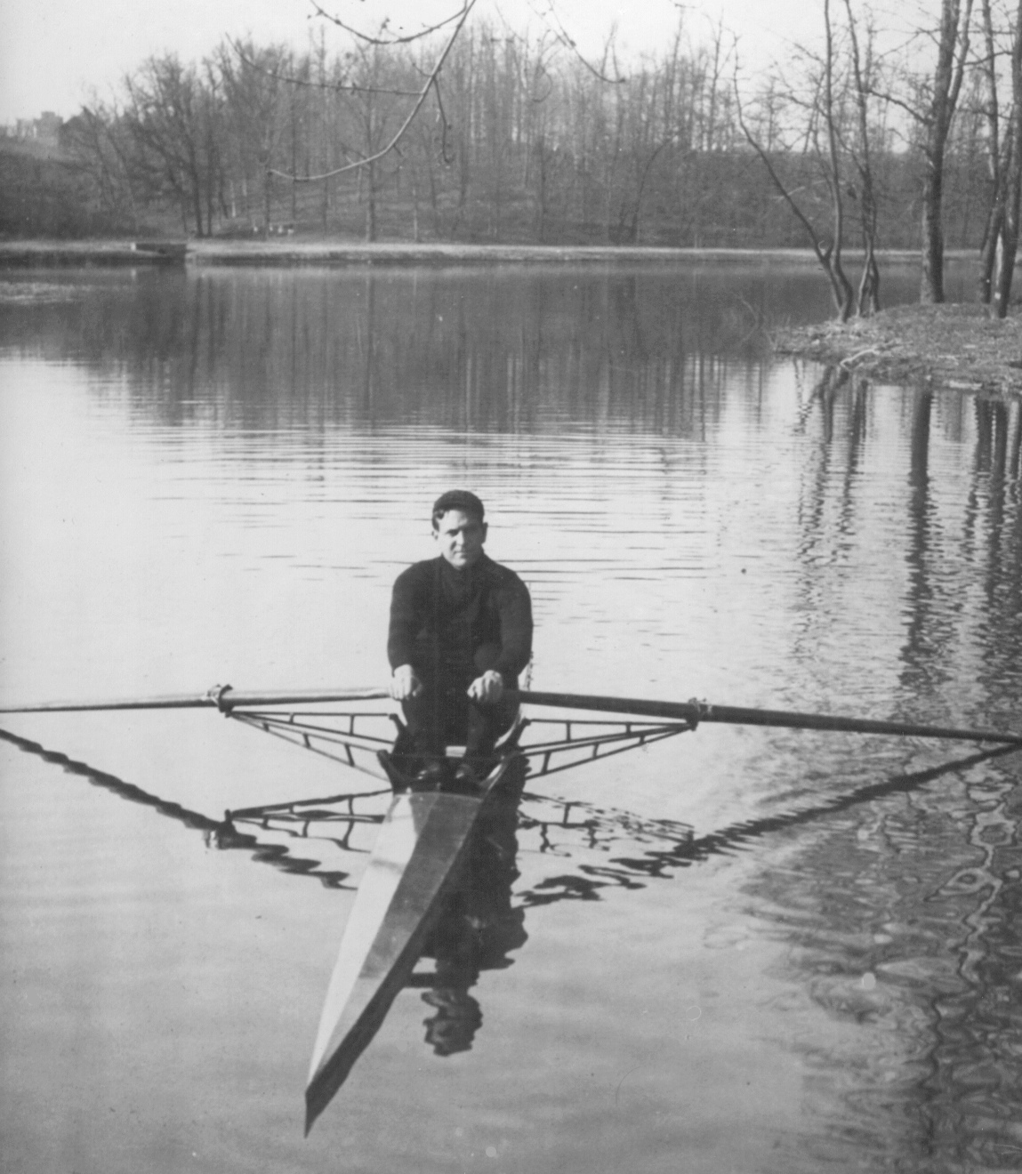 A man standing next to a body of water