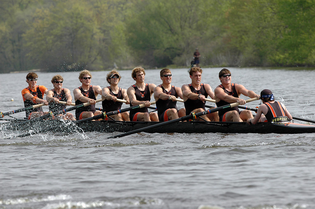 A group of people riding on the back of a boat