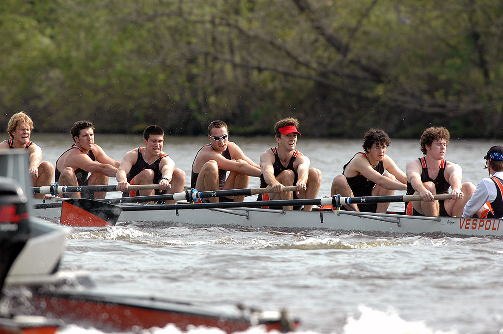 A group of people riding on the back of a boat