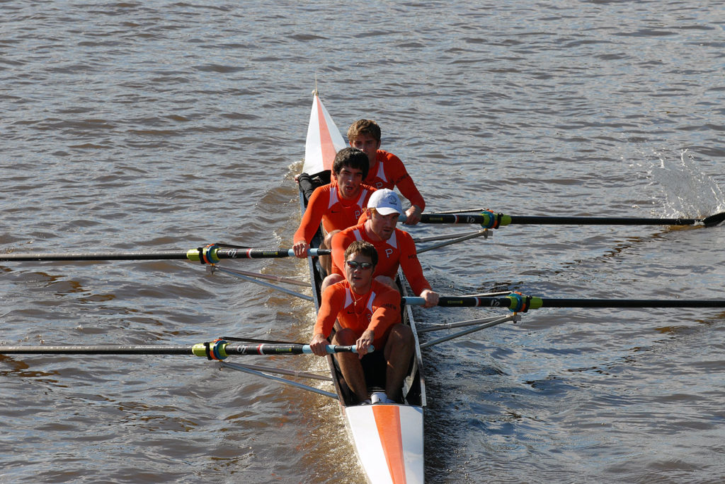 A man rowing a boat in the water