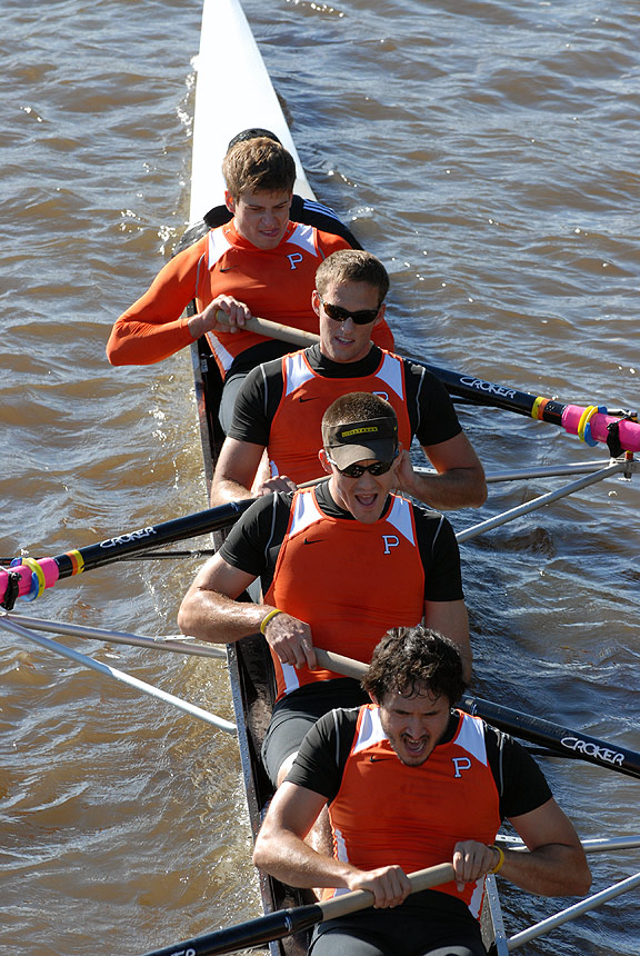 A man rowing a boat in a body of water