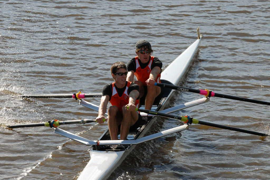 A man rowing a boat in the water