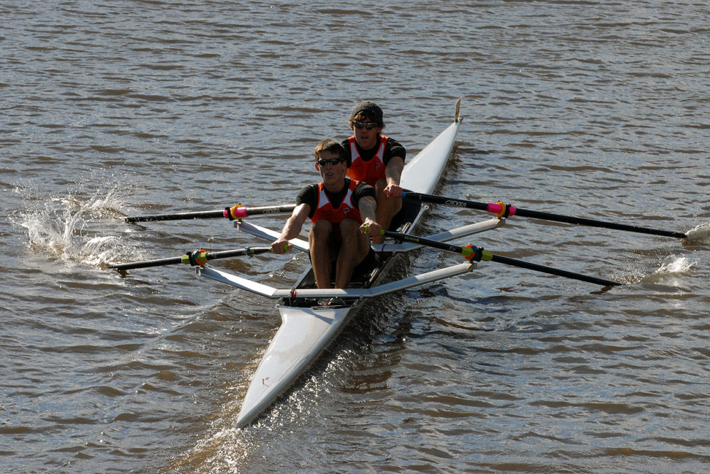 A man rowing a boat in the water