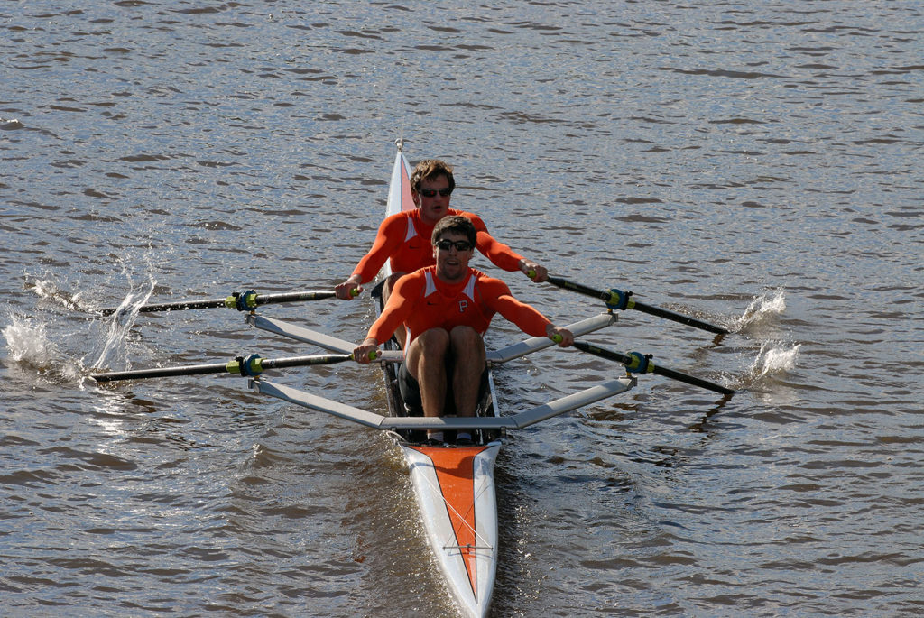 A man rowing a boat in the water