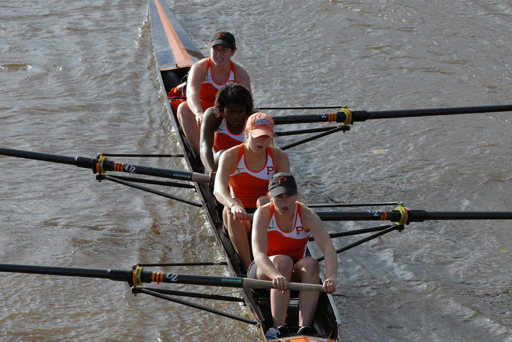 A man rowing a boat in the water