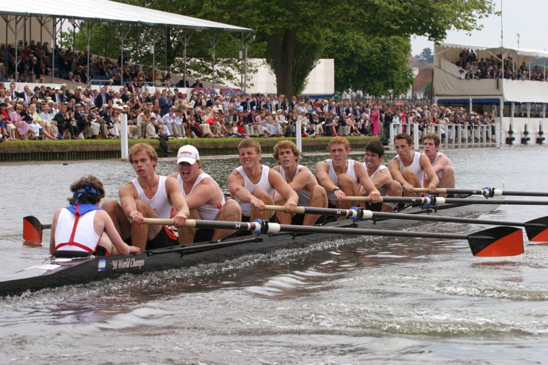 A group of people rowing a boat