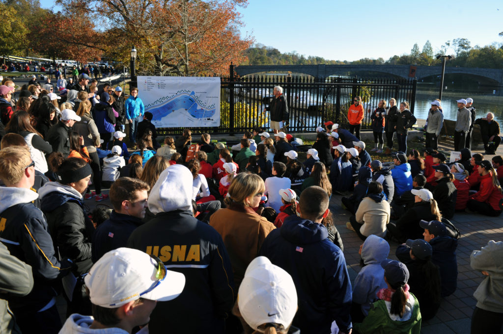 A group of people standing in front of a crowd