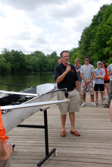 A group of people sitting at a dock