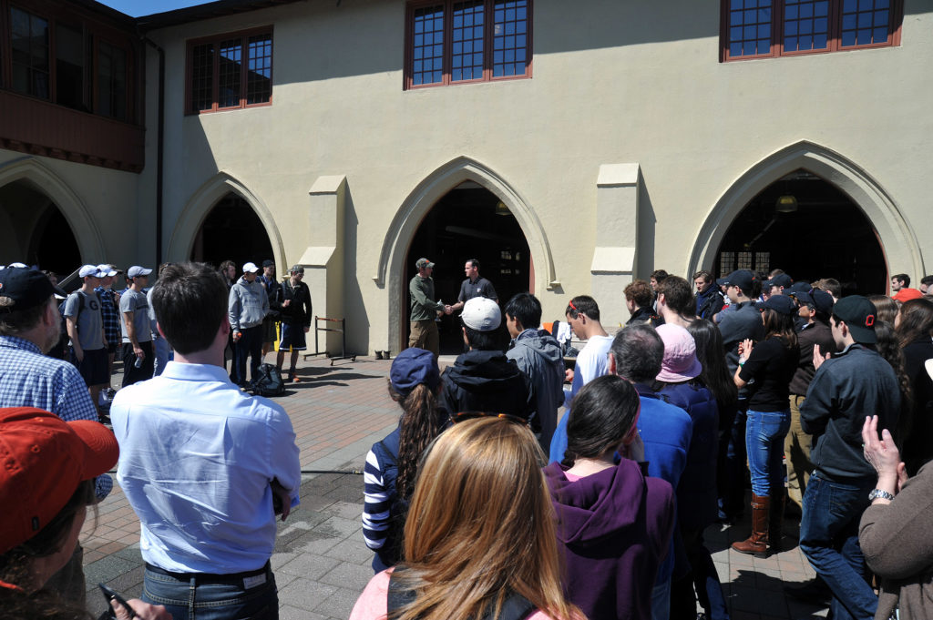 A group of people standing in front of a building