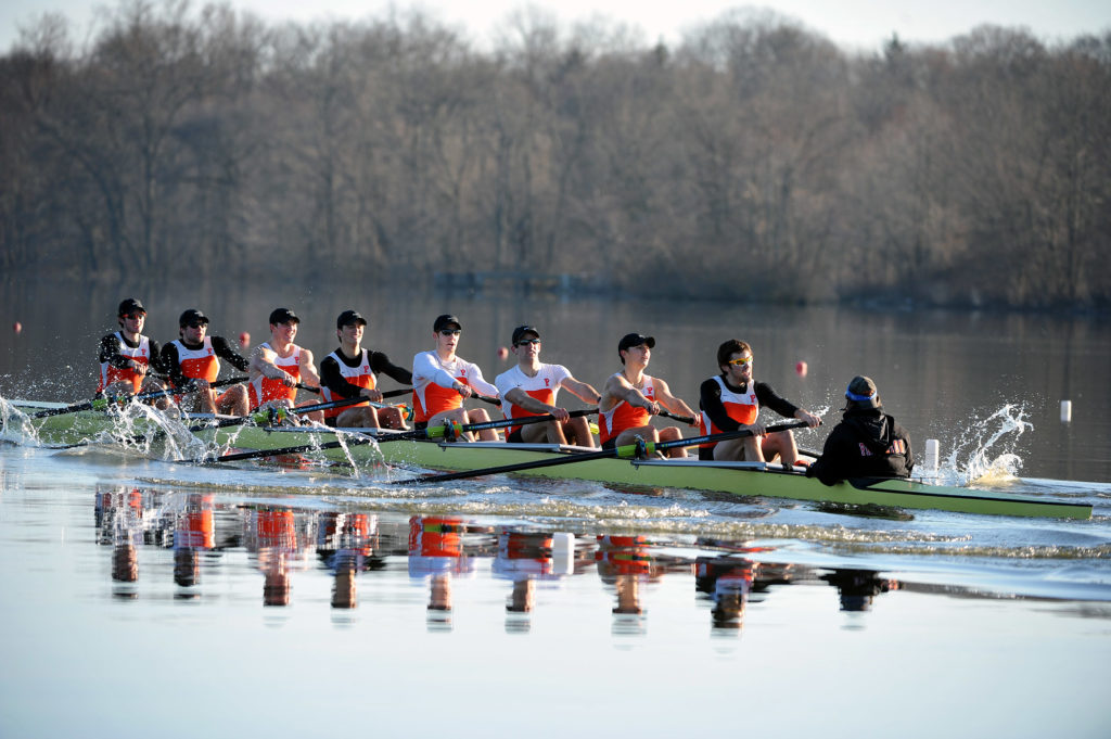 A group of people riding skis on a body of water