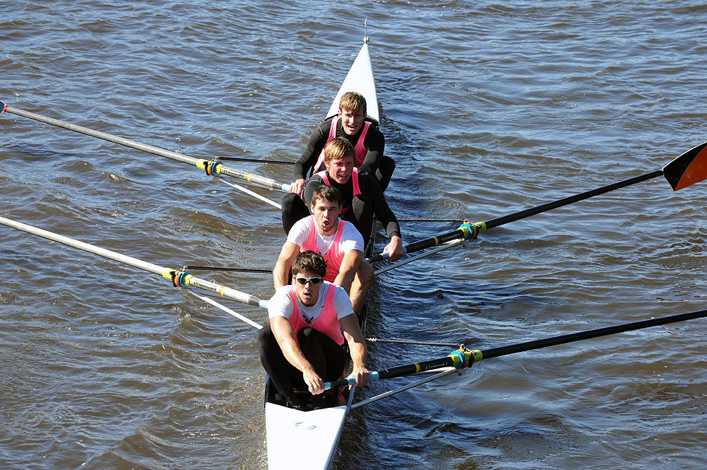 A person rowing a boat in a body of water