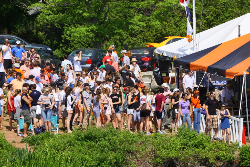 A group of people standing in front of a crowd