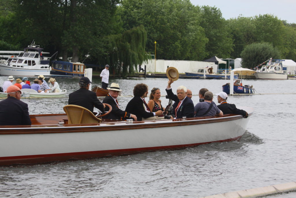 A group of people on a boat in the water