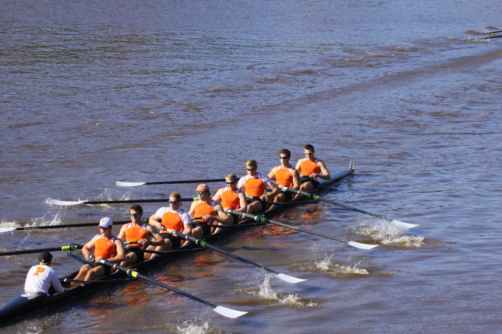 A group of people in a boat on a body of water