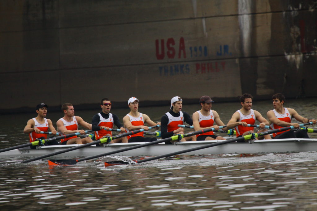 A group of people riding on the back of a boat