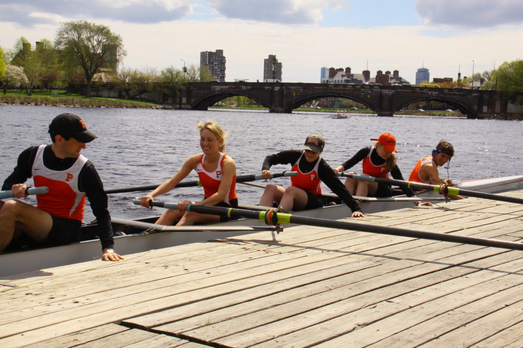 A group of people riding on the back of a boat