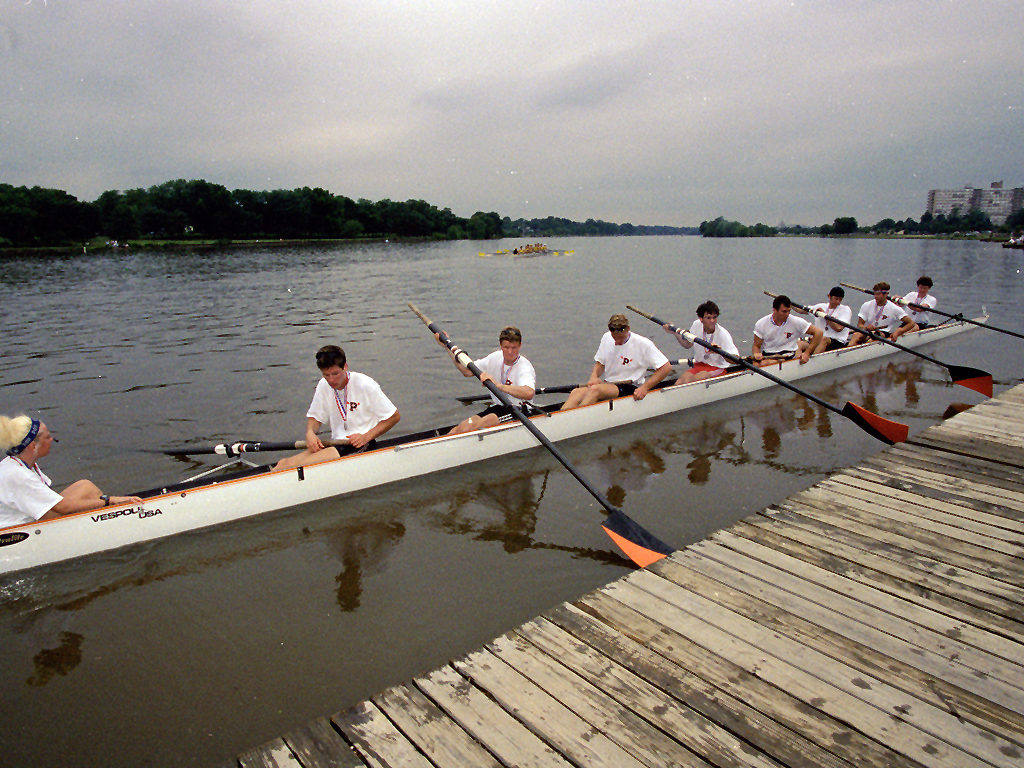 A group of people in a boat on a body of water
