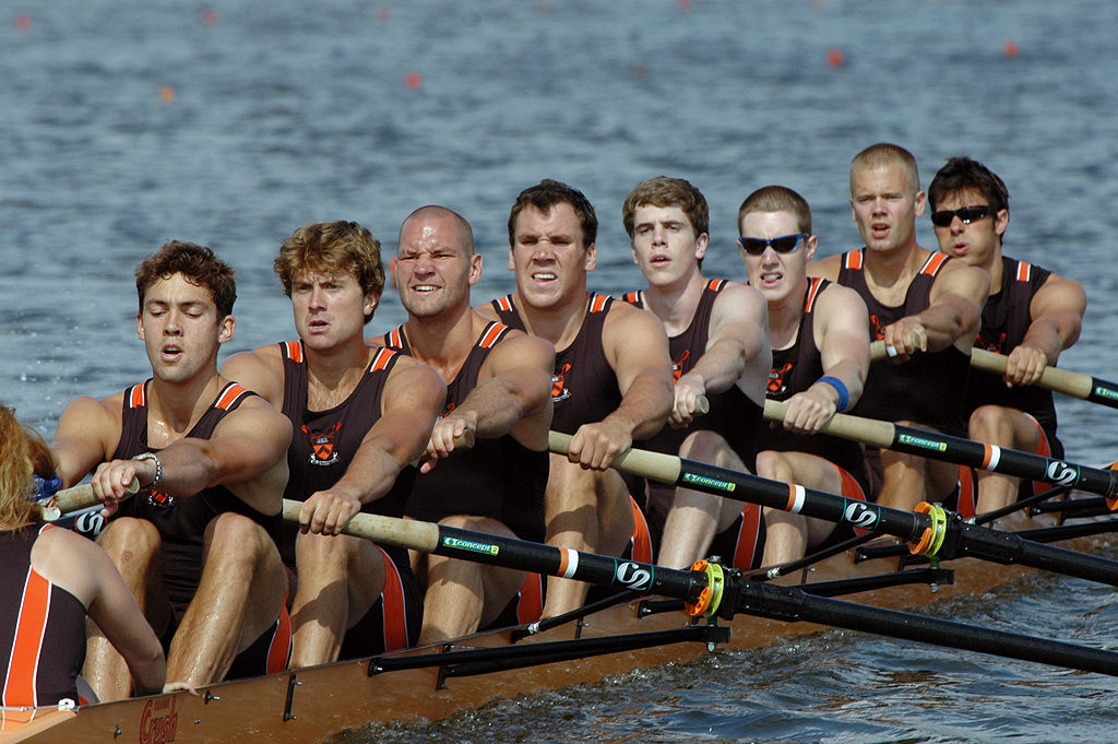 A group of people rowing a boat