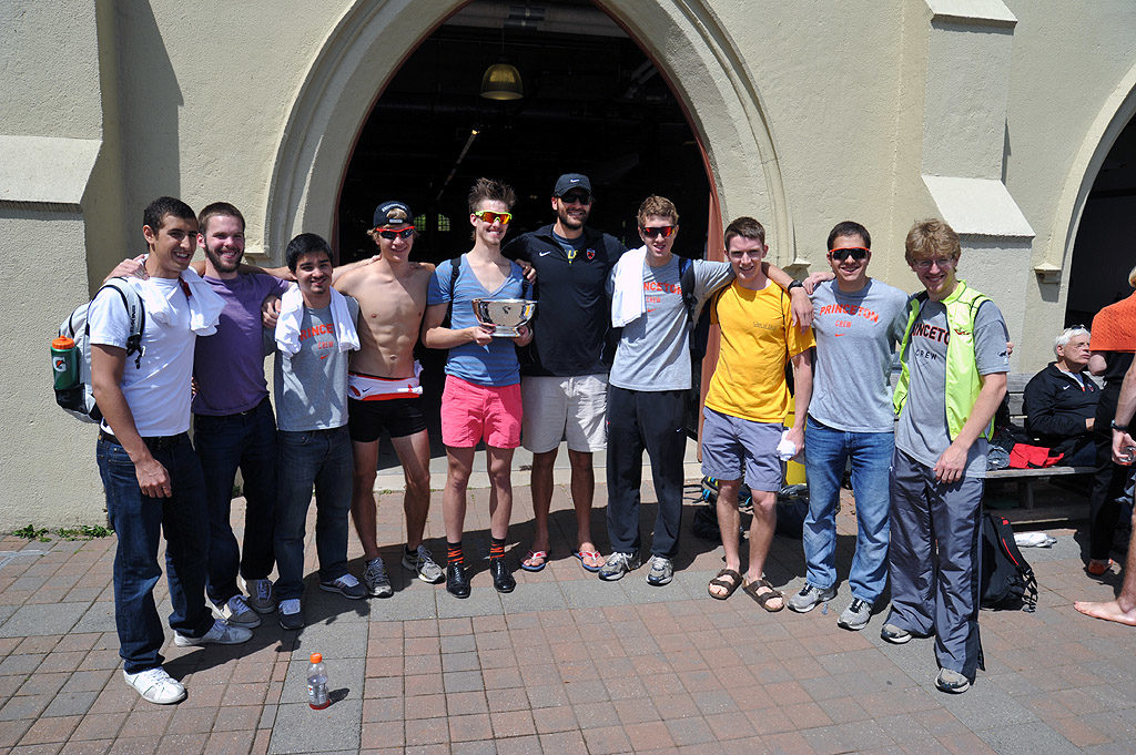 A group of people posing for a photo in front of a building