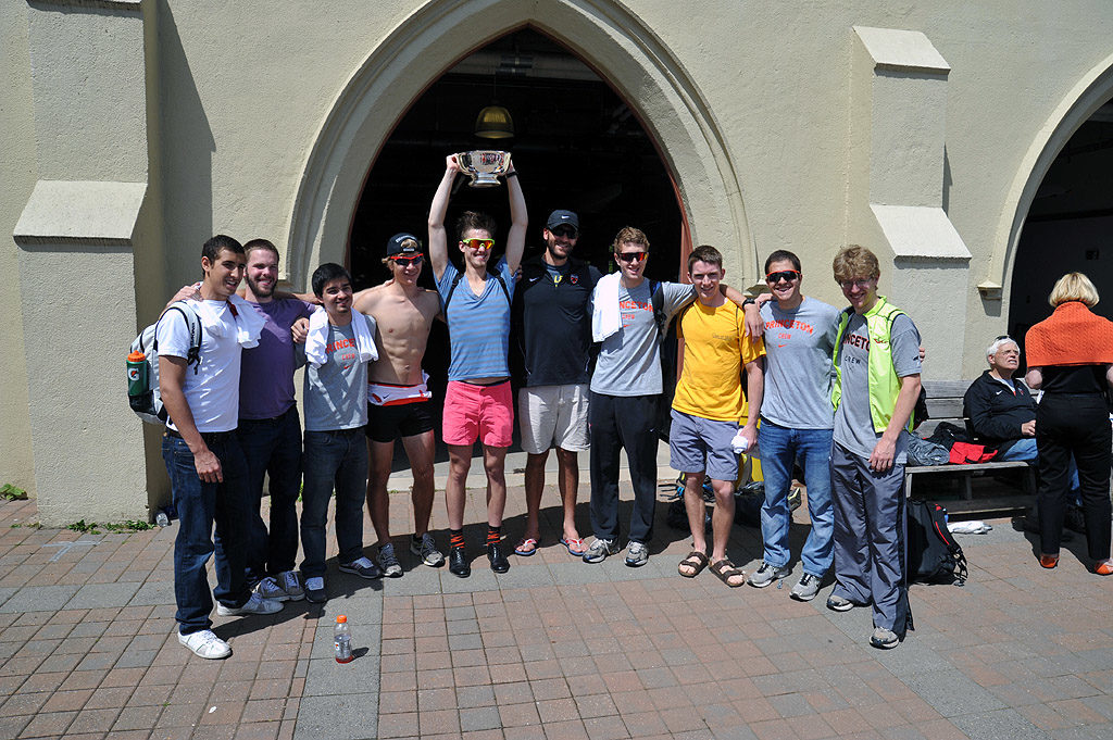 A group of people posing in front of a building