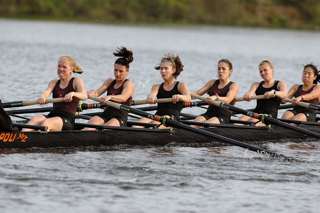 Lucas Jensen et al. rowing a boat in the water