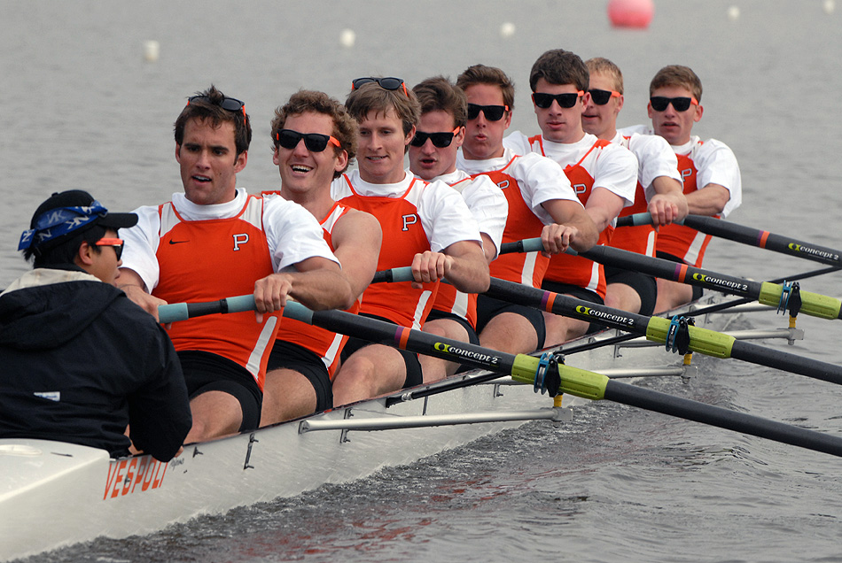 A group of people rowing a boat