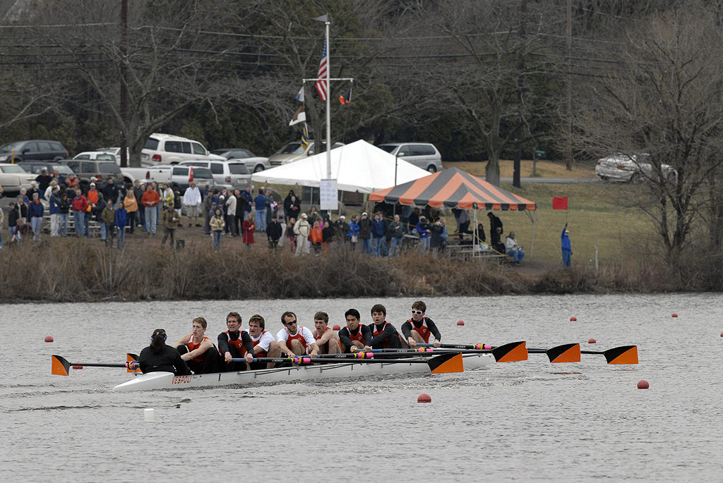 A group of people rowing a boat