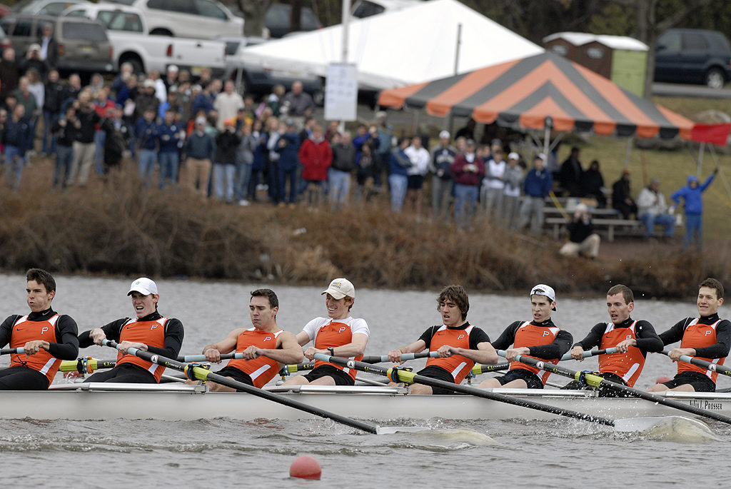 A group of people rowing a boat