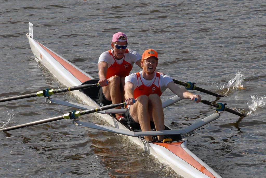 A man rowing a boat in the water