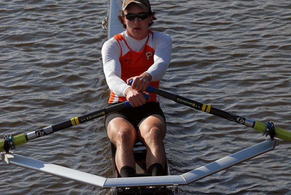 A man rowing a boat in the water