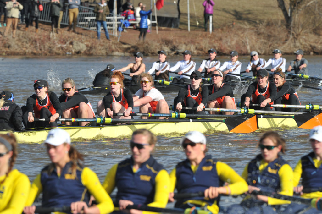 A group of people riding on the back of a boat