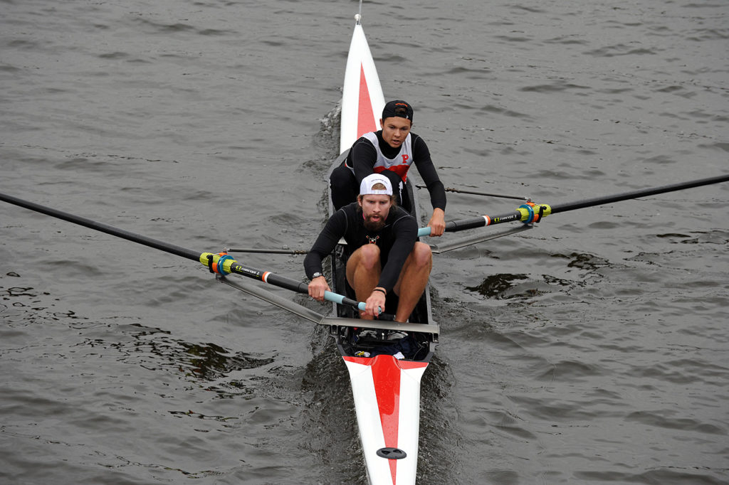 A man rowing a boat in the water