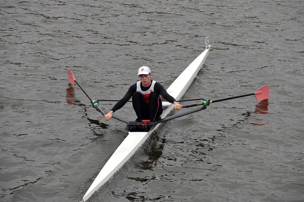 A person rowing a boat in the water