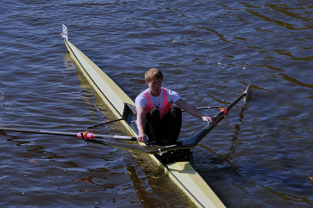 A man rowing a boat in the water