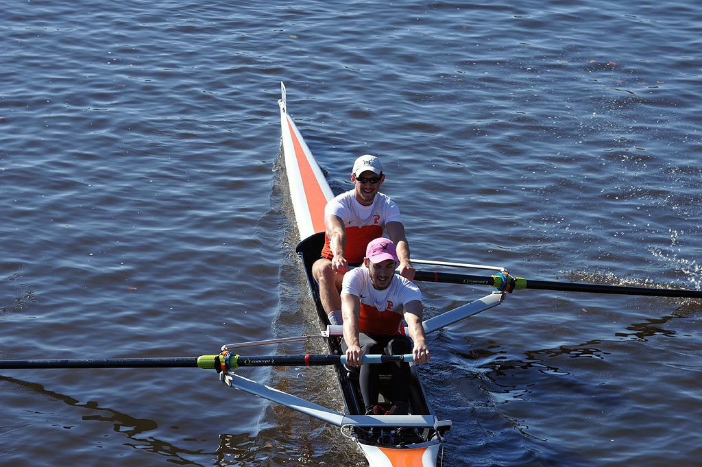 A man rowing a boat in the water