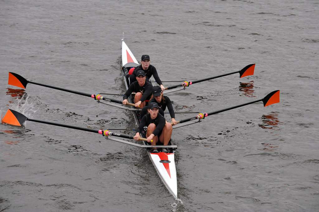 A group of people riding skis on a body of water