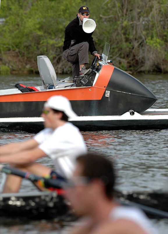 A man riding on the back of a boat