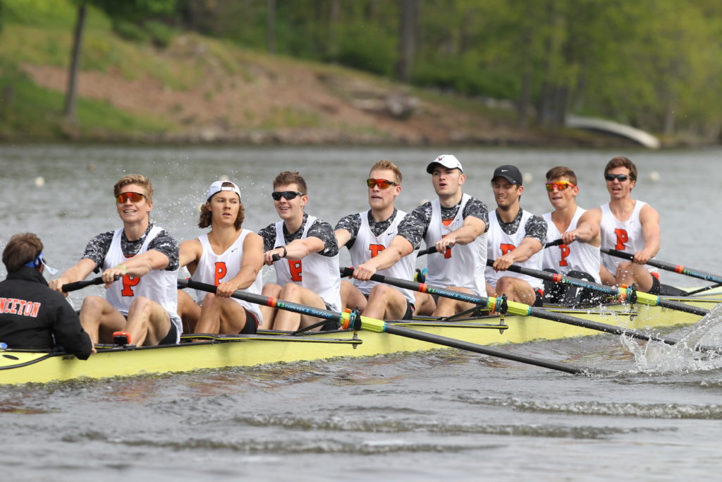 a group of people in a boat on water