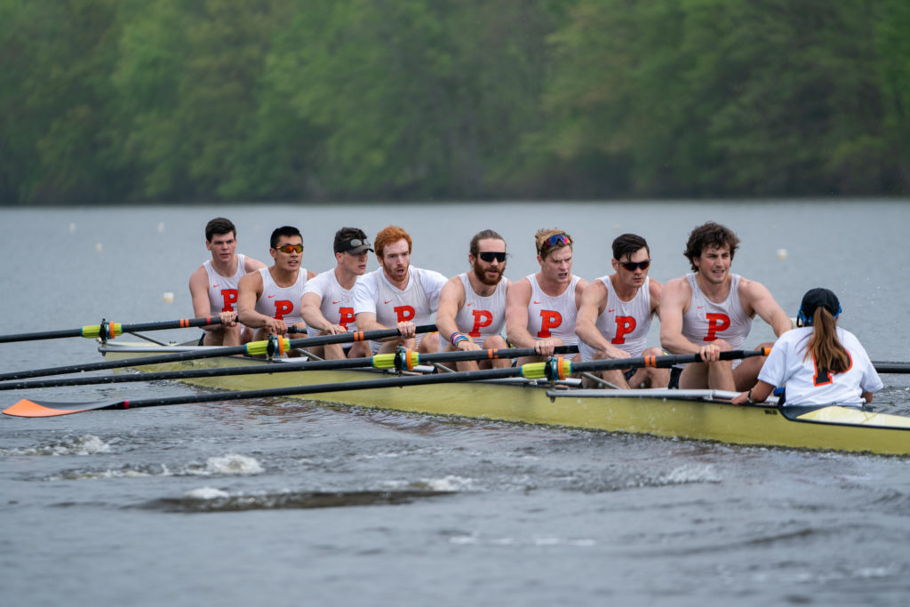 Fernando Aristeguieta et al. rowing a boat in the water