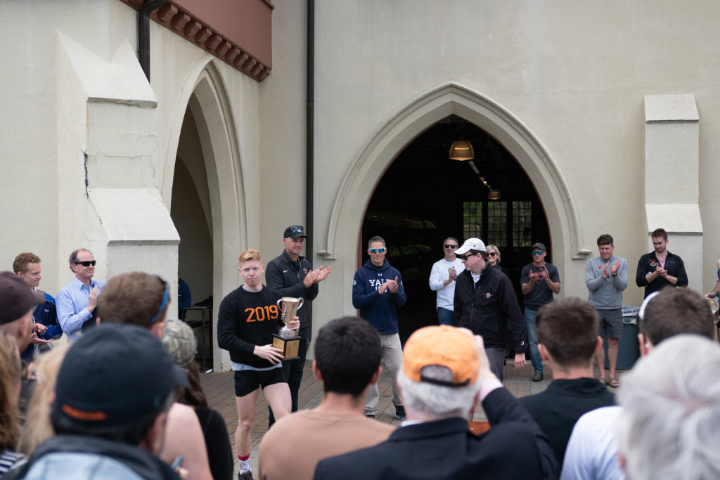 A group of people standing in front of a crowd