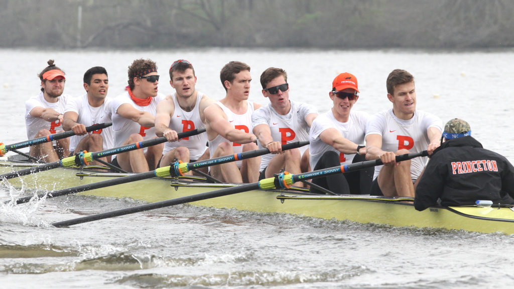 A group of people rowing a boat