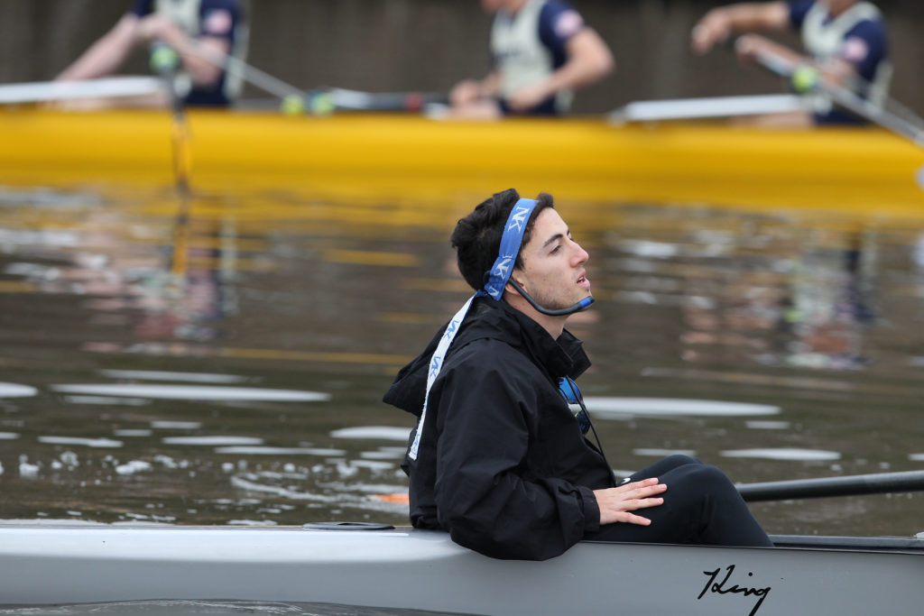 A person sitting in a chair talking on the phone in the water