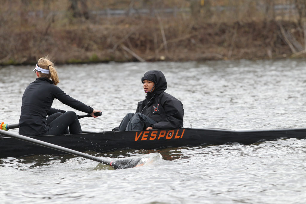 A group of people riding on the back of a boat