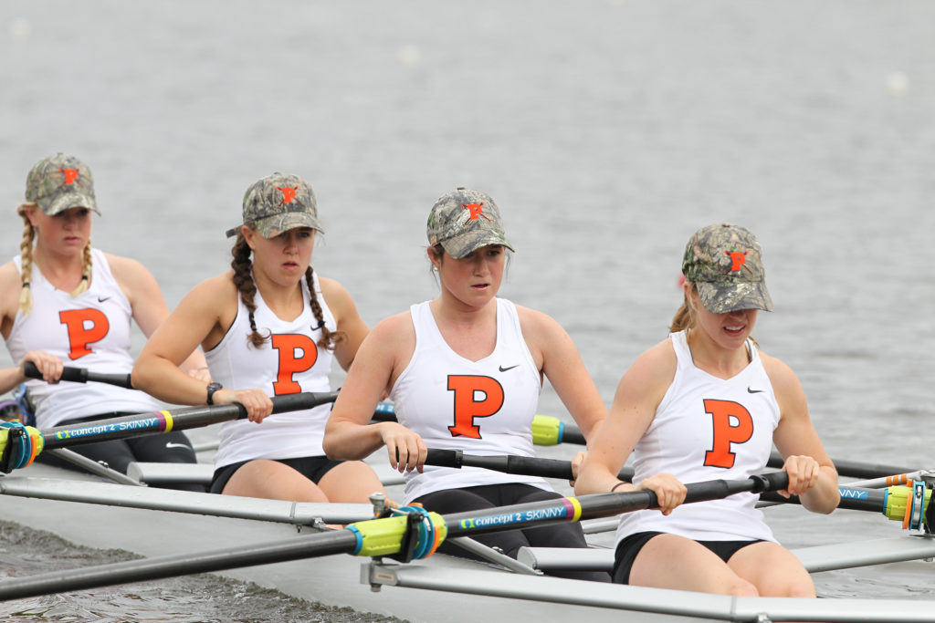 A group of people rowing a boat