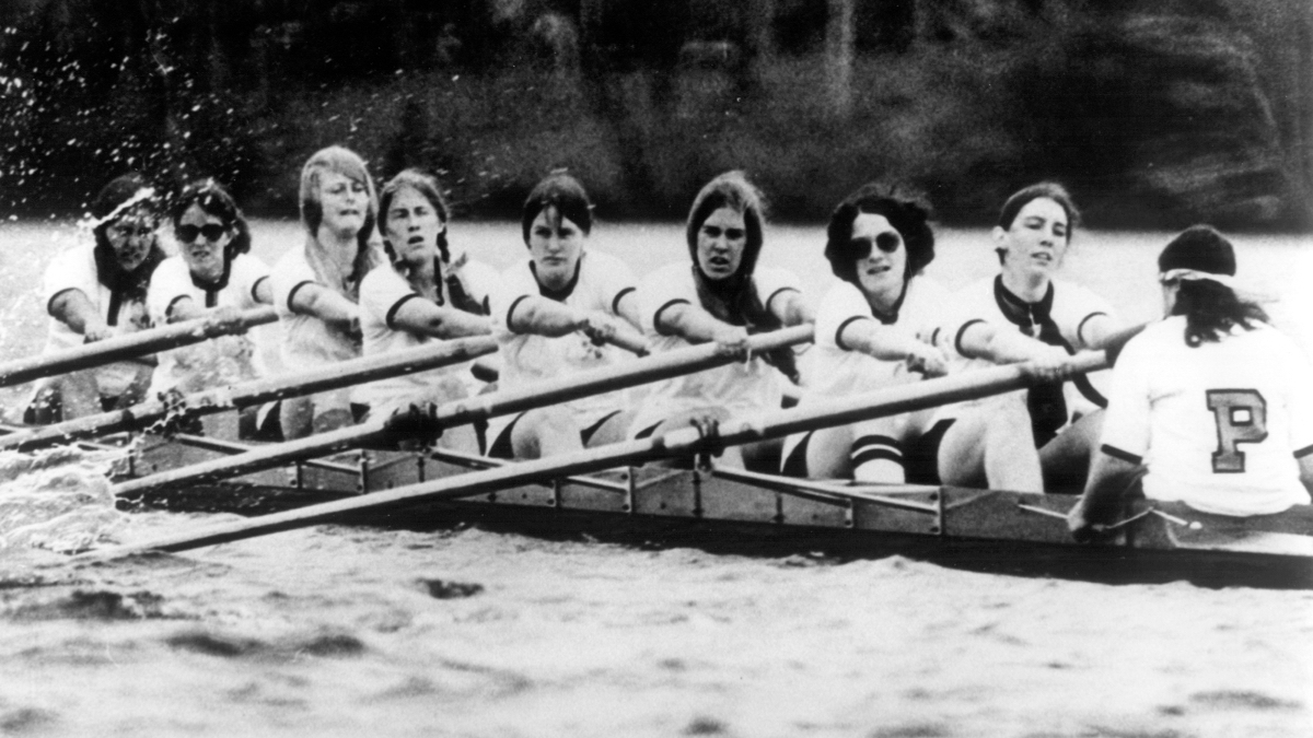 A group of people rowing a boat